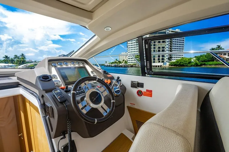 Endurance Yacht Photos Pics Interior view of 2016 Azimut Atlantis 50 yacht cockpit with scenic waterfront backdrop.