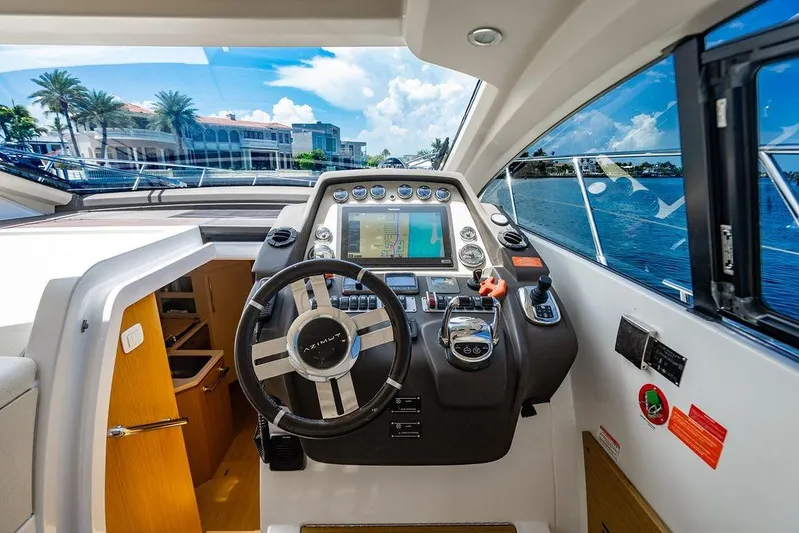 Endurance Yacht Photos Pics Cockpit of 2016 Azimut Atlantis 50 yacht with steering wheel and navigation system.