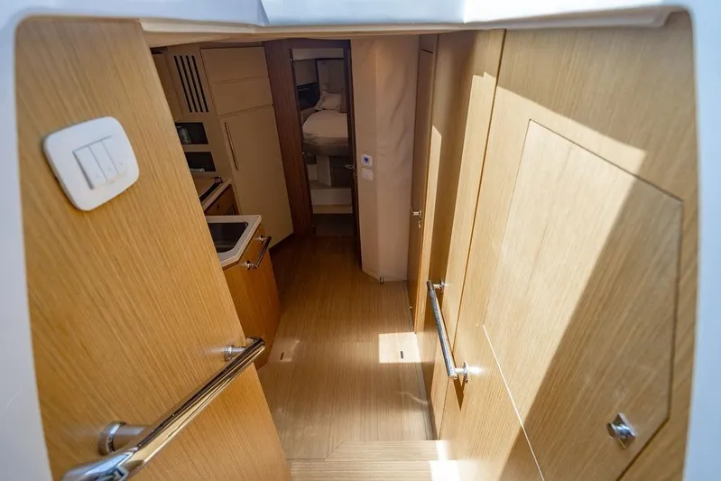Endurance Yacht Photos Pics Interior view of 2016 Azimut Atlantis 50 yacht, featuring wooden cabinetry and modern design.