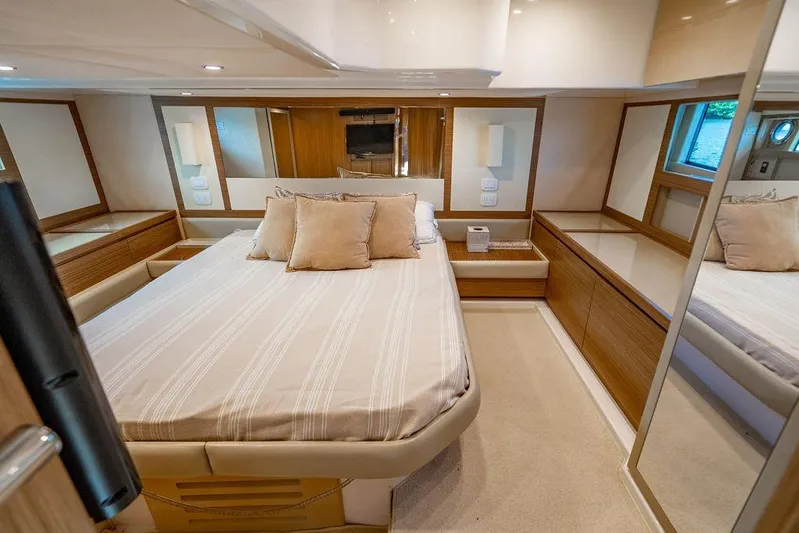 Endurance Yacht Photos Pics Luxurious bedroom interior of 2016 Azimut Atlantis 50 yacht with elegant wood finishes.