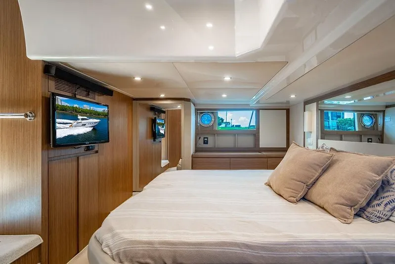 Endurance Yacht Photos Pics Luxurious interior of 2016 Azimut Atlantis 50 yacht with cozy bedroom and modern amenities.