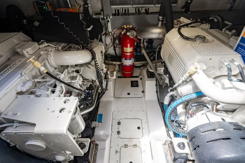 Endurance Yacht Photos Pics Engine room of a 2016 Azimut Atlantis 50 yacht, featuring dual engines and fire extinguisher.