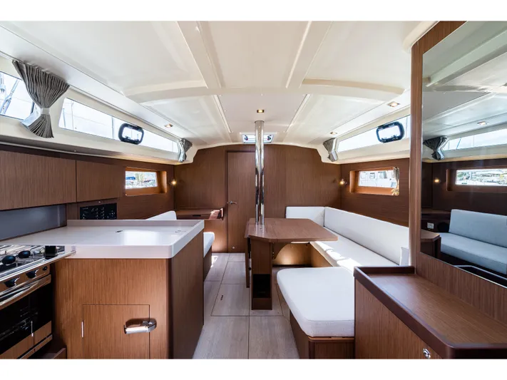  Yacht Photos Pics Interior of 2020 Beneteau Oceanis 41.1 yacht, featuring modern wood finishes and spacious seating.