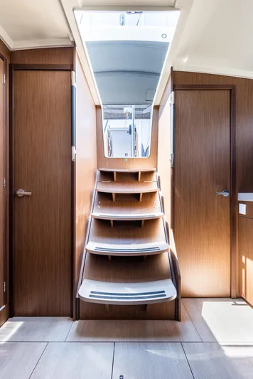  Yacht Photos Pics Interior of 2020 Beneteau Oceanis 41.1 yacht with wooden stairs and doors.