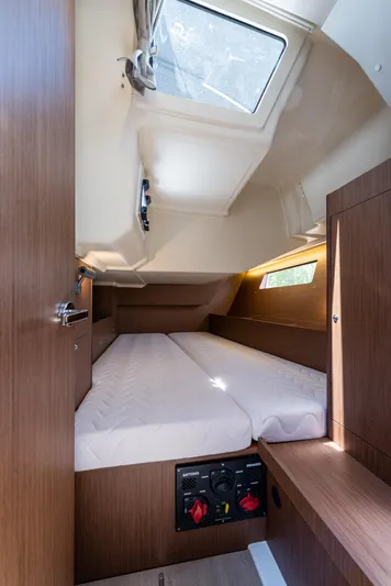  Yacht Photos Pics 2020 Beneteau Oceanis 41.1 cabin interior with bed, skylight, and wooden finish.