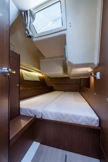  Yacht Photos Pics Interior cabin of 2020 Beneteau Oceanis 41.1 yacht with skylight and wooden finish.