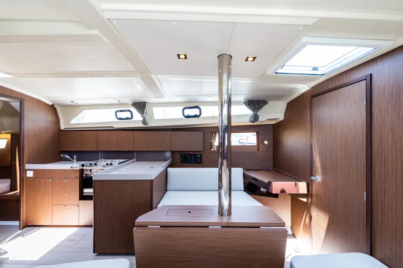  Yacht Photos Pics Interior of 2020 Beneteau Oceanis 41.1 yacht, featuring modern wood finishes and ample natural light.