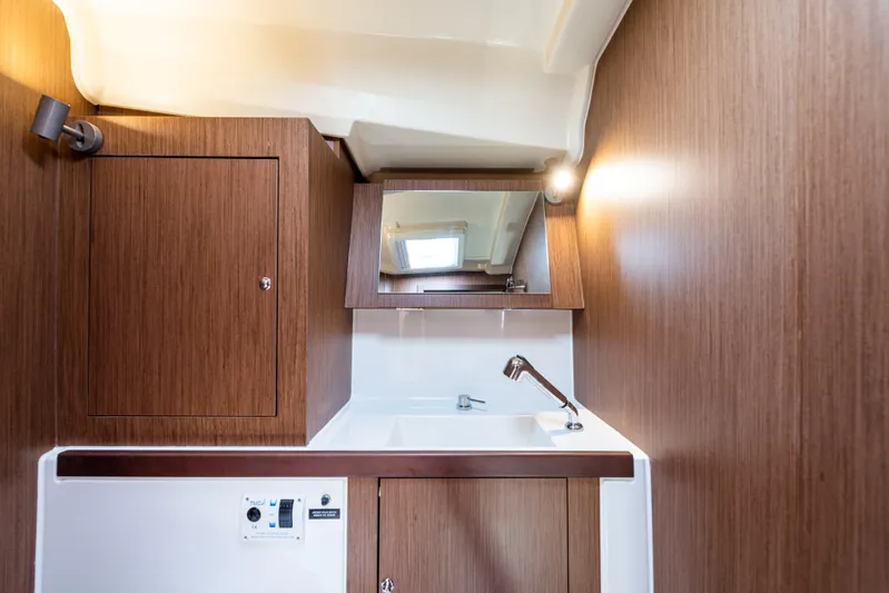  Yacht Photos Pics Beneteau Oceanis 41.1 2020 yacht bathroom with wooden cabinetry and modern sink.