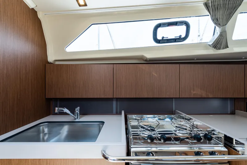  Yacht Photos Pics Modern kitchen in 2020 Beneteau Oceanis 41.1 yacht with sink and stove.