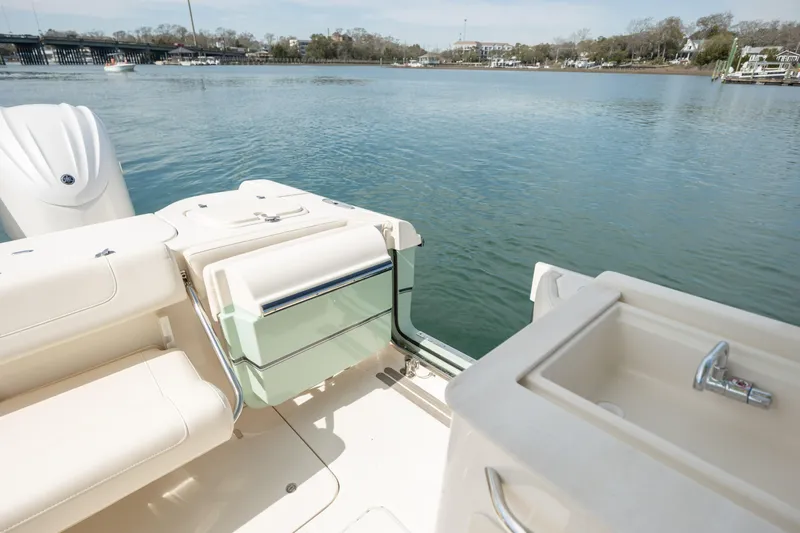  Yacht Photos Pics 2023 Grady-White Freedom 285 boat interior with seating and water view.