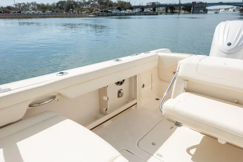  Yacht Photos Pics 2023 Grady-White Freedom 285 boat interior with seating, near calm water.