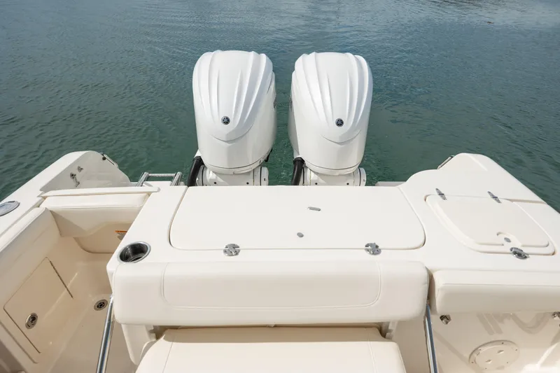  Yacht Photos Pics 2023 Grady-White Freedom 285 boat with dual engines on calm water.