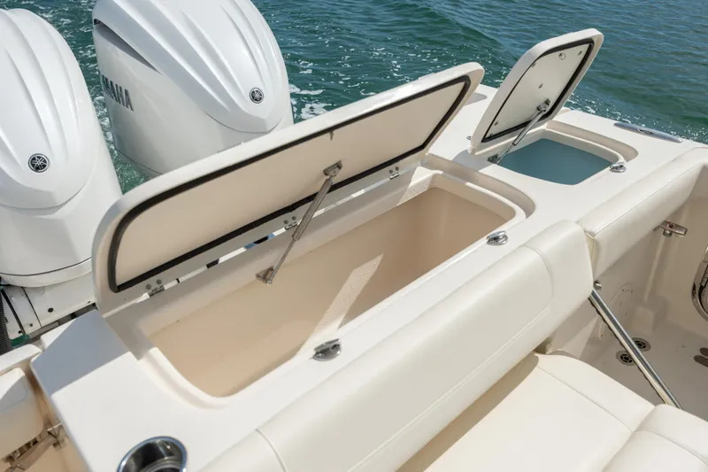  Yacht Photos Pics 2023 Grady-White Freedom 285 boat with open storage compartments and Yamaha engines.
