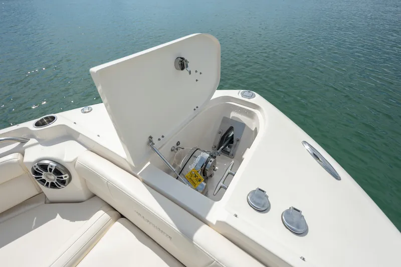  Yacht Photos Pics 2023 Grady-White Freedom 285 boat anchor compartment open on calm water.