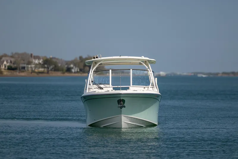  Yacht Photos Pics 2023 Grady-White Freedom 285 boat on calm water, front view.
