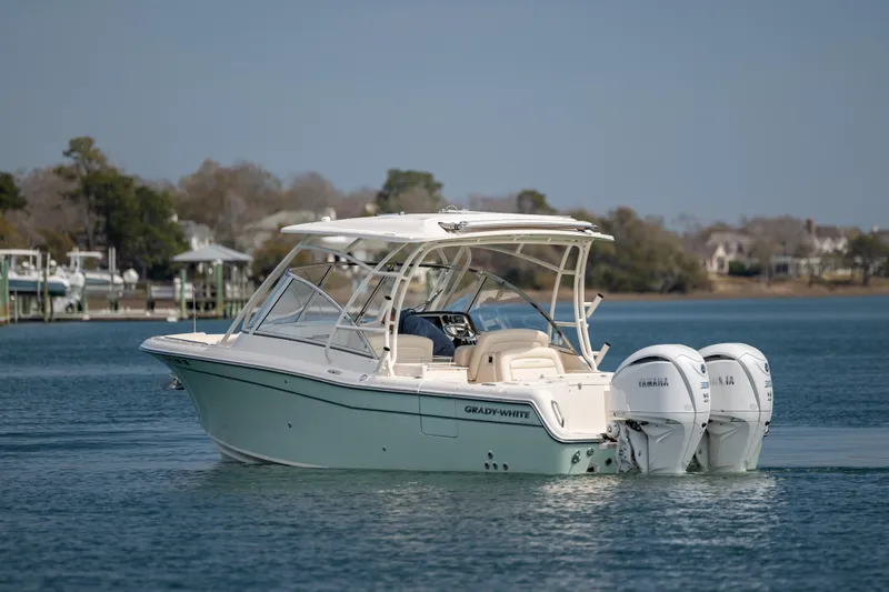  Yacht Photos Pics 2023 Grady-White Freedom 285 boat with dual Yamaha engines on calm water.