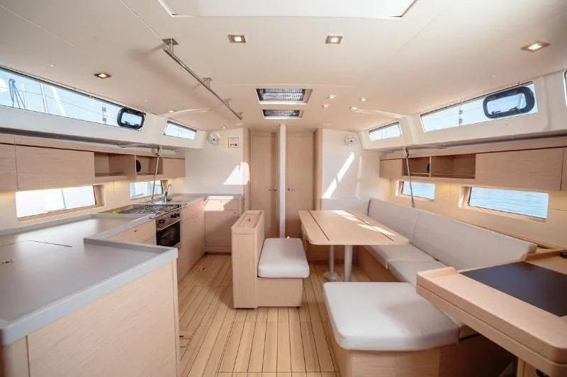  Yacht Photos Pics Spacious interior of 2019 Beneteau Oceanis 46.1 yacht with modern kitchen and seating area.