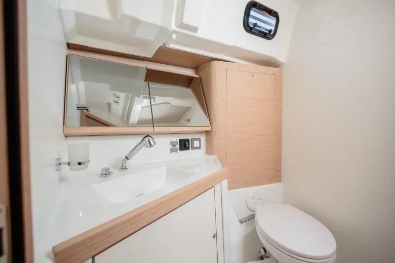  Yacht Photos Pics Modern bathroom interior of 2019 Beneteau Oceanis 46.1 yacht with sink and toilet.