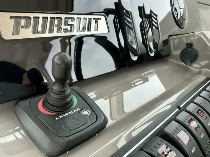  Yacht Photos Pics Control panel of 2019 Pursuit DC 325 Dual Console boat with joystick and switches.
