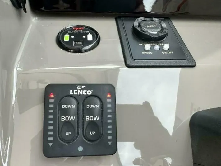  Yacht Photos Pics Control panel of a 2019 Pursuit DC 325 Dual Console boat with Lenco trim tabs.