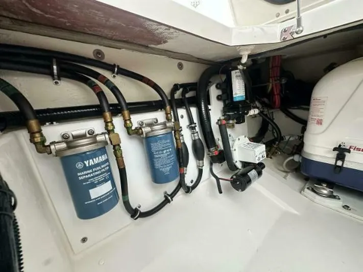  Yacht Photos Pics Engine compartment of a 2019 Pursuit DC 325 Dual Console boat, showing Yamaha filters and wiring.