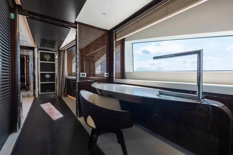 Domani Yacht Photos Pics Luxurious interior of 2016 Benetti Custom Built yacht with sleek desk and large window view.
