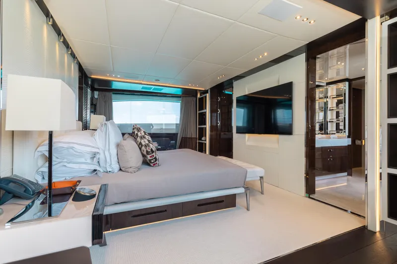 Domani Yacht Photos Pics Luxurious bedroom interior on 2016 Benetti Custom Built yacht, featuring modern design and elegant furnishings.