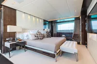 Luxurious bedroom interior on 2016 Benetti Custom Built yacht, featuring elegant decor and large window views.