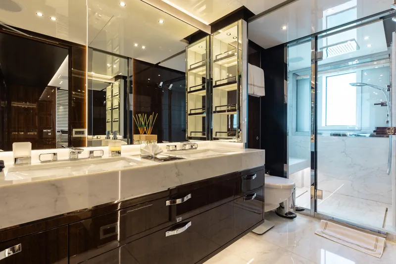 Domani Yacht Photos Pics Luxurious bathroom in 2016 Benetti Custom Built yacht with marble countertops and glass shower.