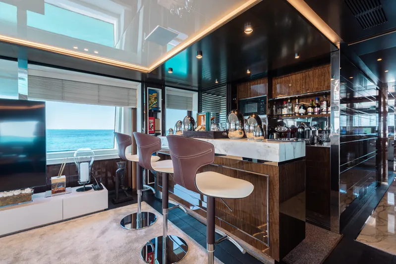 Domani Yacht Photos Pics Luxurious yacht interior with modern bar, ocean view; Benetti Custom Built, 2016.