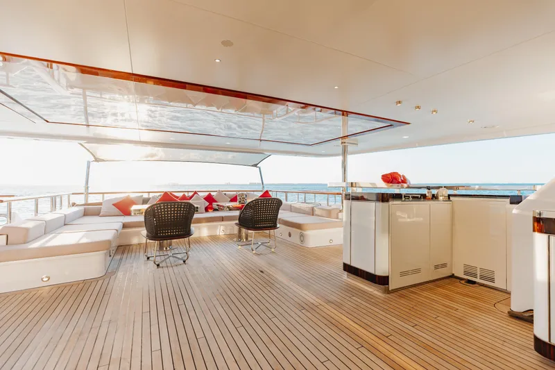 Domani Yacht Photos Pics Luxurious Benetti Custom Built 2016 yacht deck with elegant seating and ocean view.