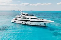 Luxurious 2016 Benetti Custom Built yacht cruising in clear blue ocean waters.
