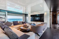 Luxurious interior of 2016 Benetti Custom Built yacht with ocean view and modern furnishings.