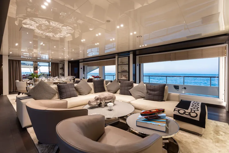 Domani Yacht Photos Pics Luxurious interior of 2016 Benetti Custom Built yacht with elegant seating and ocean view.