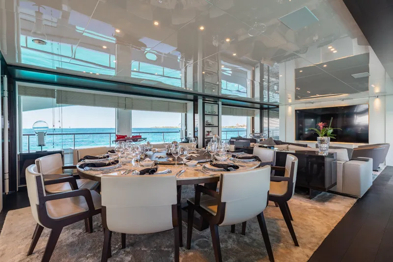 Domani Yacht Photos Pics Luxurious dining area on 2016 Benetti Custom Built yacht with ocean view.