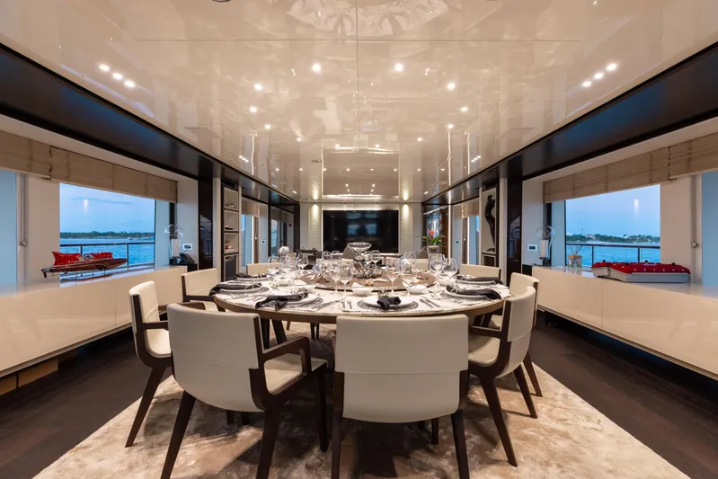 Domani Yacht Photos Pics Luxurious dining area on a 2016 Benetti Custom Built yacht, featuring elegant table settings.