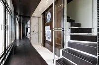 Luxurious interior of 2016 Benetti Custom Built yacht with modern staircase and elegant decor.