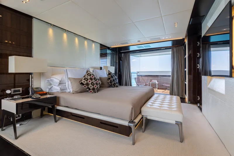 Domani Yacht Photos Pics Luxurious bedroom on 2016 Benetti Custom Built yacht with elegant decor and ocean view.