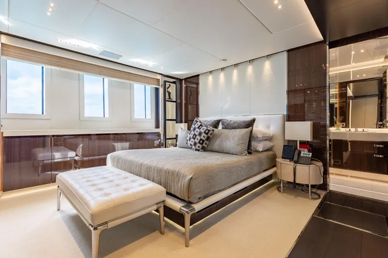 Domani Yacht Photos Pics Luxurious bedroom interior on 2016 Benetti Custom Built yacht, featuring elegant decor and modern amenities.