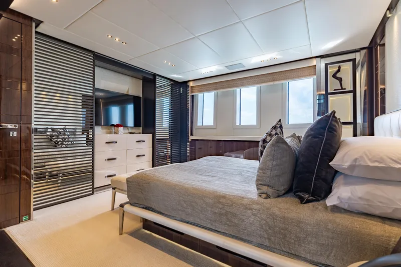 Domani Yacht Photos Pics Luxurious bedroom interior on a 2016 Benetti Custom Built yacht, featuring modern design and elegant furnishings.