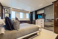 Luxurious bedroom interior on 2016 Benetti Custom Built yacht, featuring modern design and elegant furnishings.