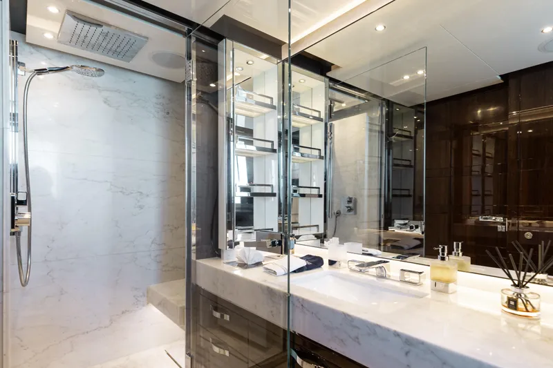 Domani Yacht Photos Pics Luxurious bathroom in 2016 Benetti Custom Built yacht with marble and glass accents.