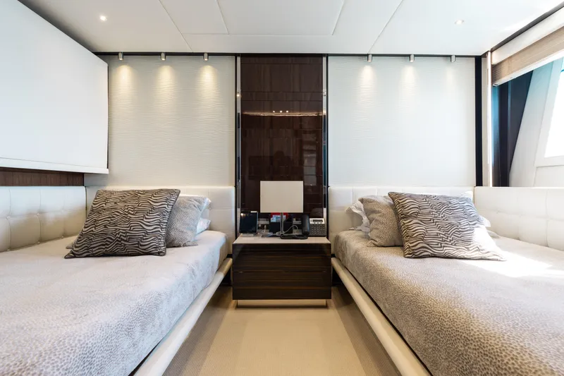 Domani Yacht Photos Pics Luxurious twin bedroom on 2016 Benetti Custom Built yacht, featuring elegant decor and modern amenities.