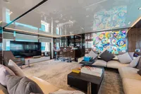 Luxurious Benetti Custom Built 2016 yacht interior with modern decor and vibrant artwork.