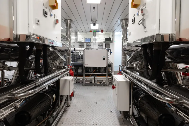 Domani Yacht Photos Pics Engine room of 2016 Benetti Custom Built yacht, featuring advanced machinery and control systems.