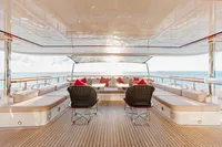 Luxurious 2016 Benetti Custom Built yacht deck with elegant seating and ocean view.