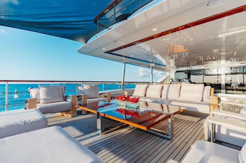 Domani Yacht Photos Pics Luxurious Benetti Custom Built 2016 yacht deck with elegant seating and ocean view.