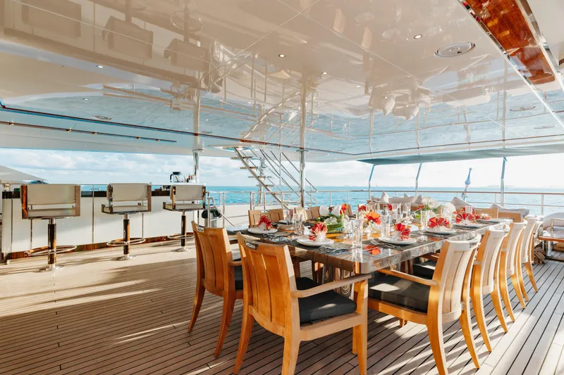 Domani Yacht Photos Pics Luxurious dining area on 2016 Benetti Custom Built yacht with ocean view.