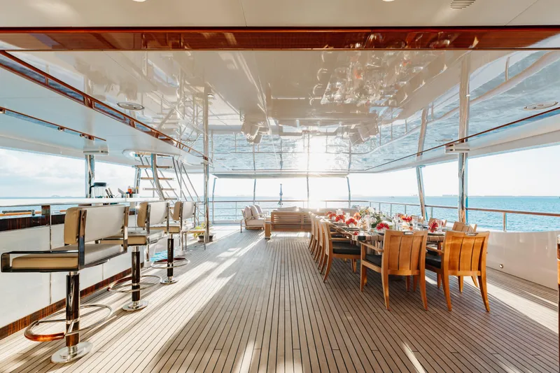 Domani Yacht Photos Pics Luxurious 2016 Benetti Custom Built yacht with elegant dining area and ocean view.