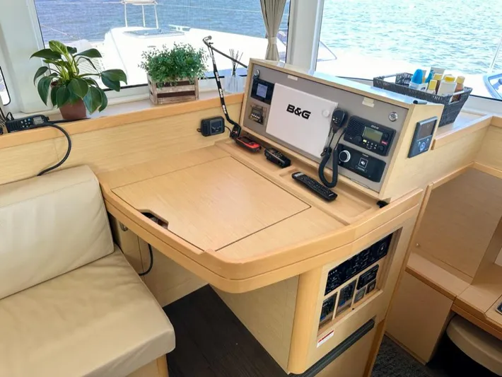 Never Say Never Yacht Photos Pics Interior of 2017 Lagoon 42 yacht with navigation equipment and seating area.
